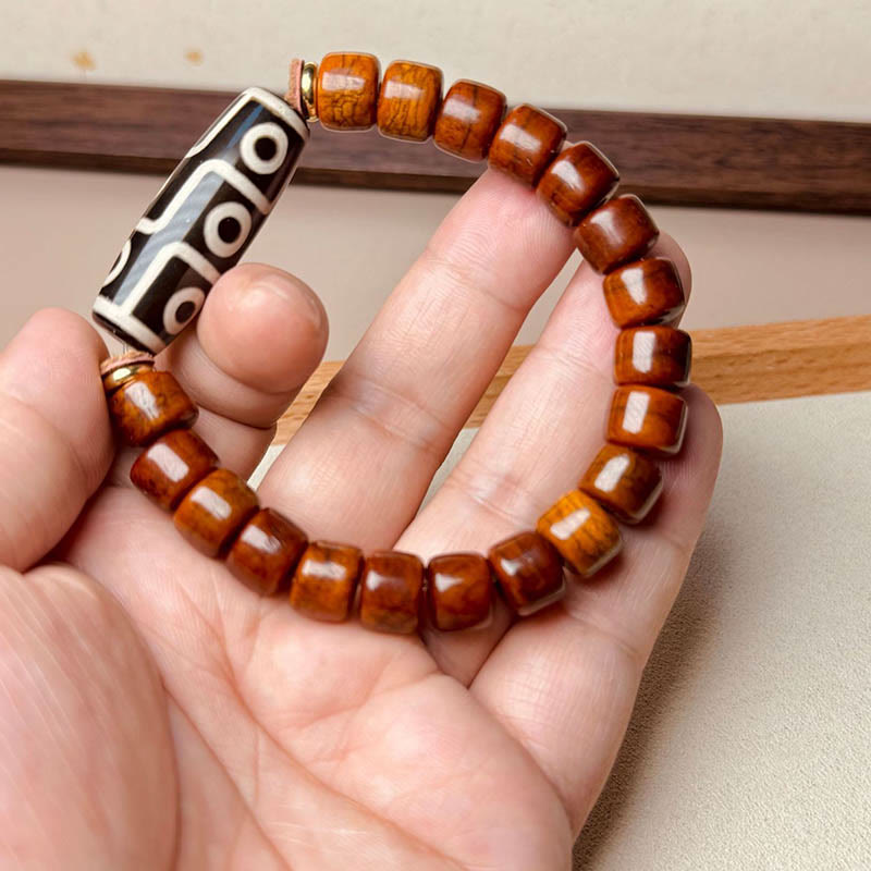 Bracelet de protection Foviel en os tibétain avec perle Dzi à neuf yeux