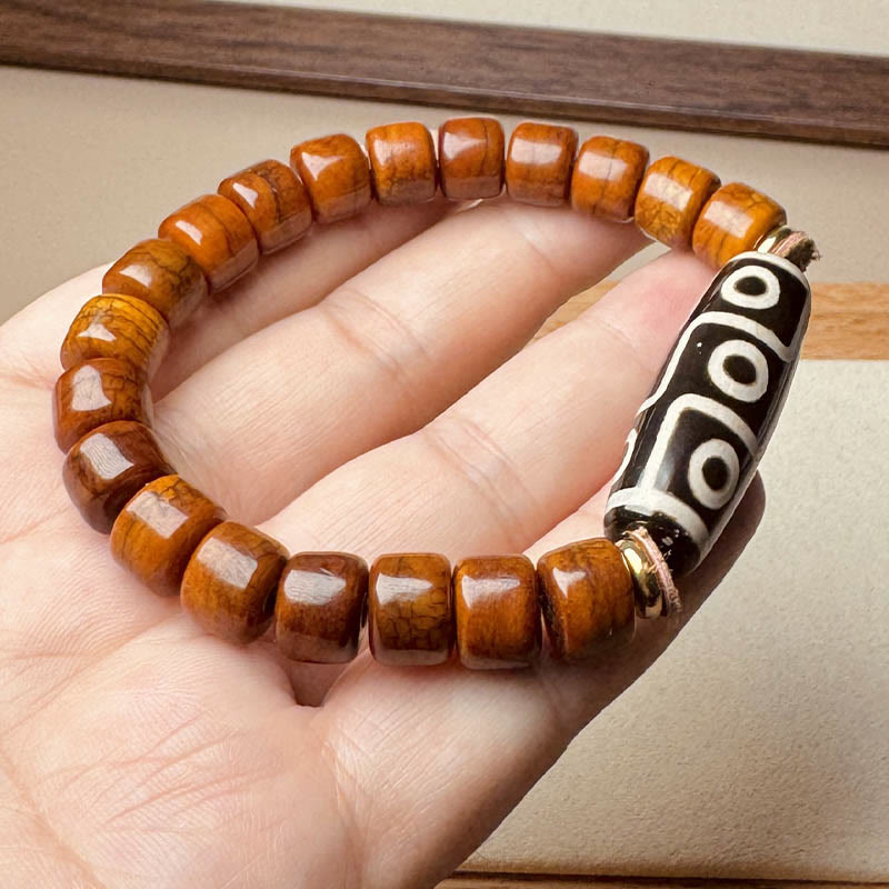 Bracelet de protection Foviel en os tibétain avec perle Dzi à neuf yeux