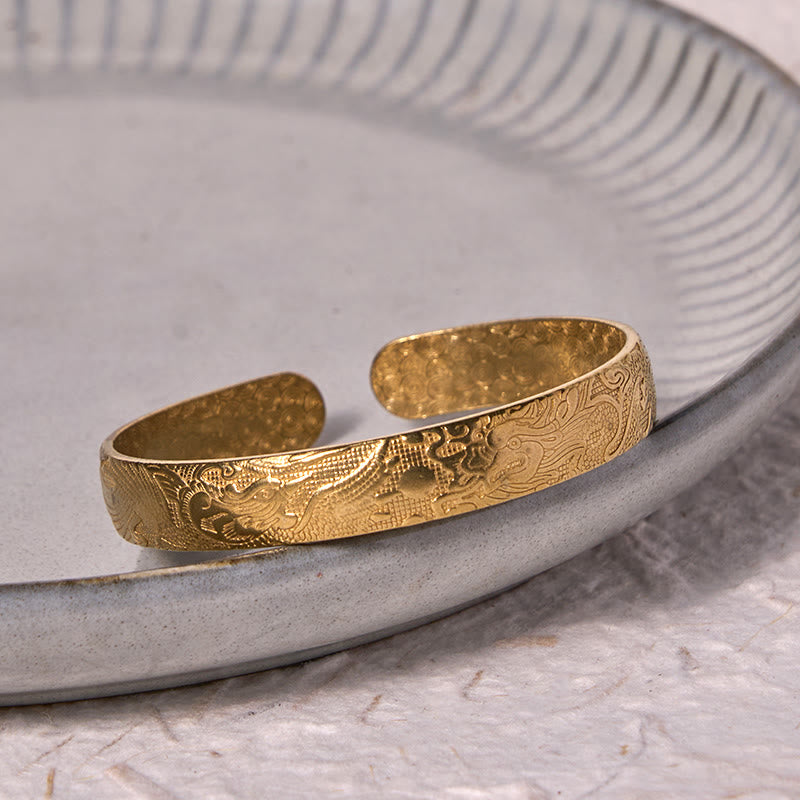 Bracelet jonc porte-bonheur en cuivre et laiton sculpté motif Dragon et Phénix jouant avec une perle Foviel