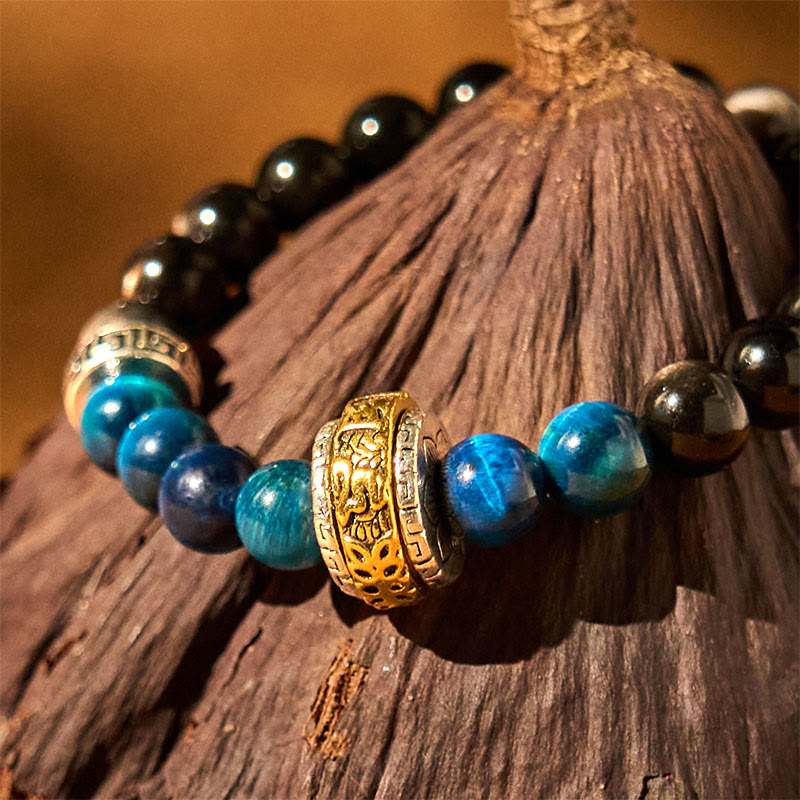 Bracelet de protection Foviel en obsidienne argentée, œil de tigre bleu et mantra Om Mani Padme Hum