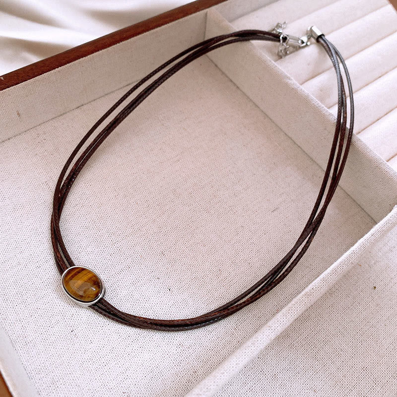 Pendentif collier Foviel en forme d'ellipse en œil-de-tigre naturel avec cordon ciré de protection