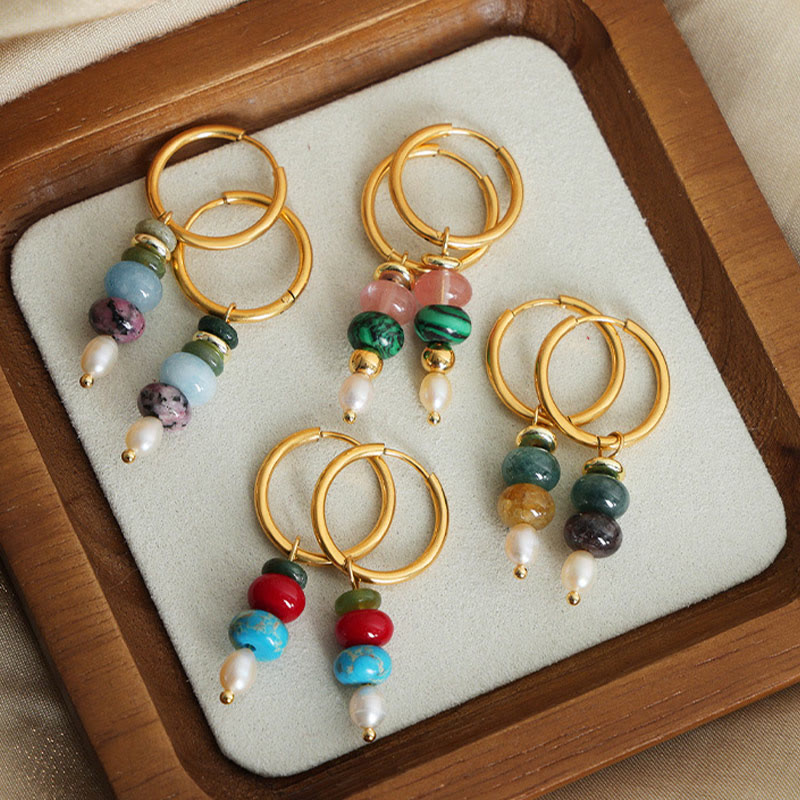 Boucles d'oreilles Foviel en acier titane avec perles en agate rouge naturelle et design de pierre Marnyi tibétaine, symbole de confiance
