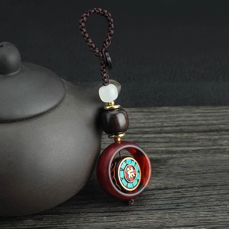 Buddha Stones Ebony Wood Sanskrit Four-leaf Clover Buddha's Eye Peace Rotatable Key Chain - Sanskrit Pattern - image 0