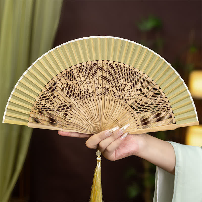 Buddha Stones Bamboo Hollow-Carved Famous Spots Landscapes Animals Tassel Folding Fan - Plum Blossom - image 4