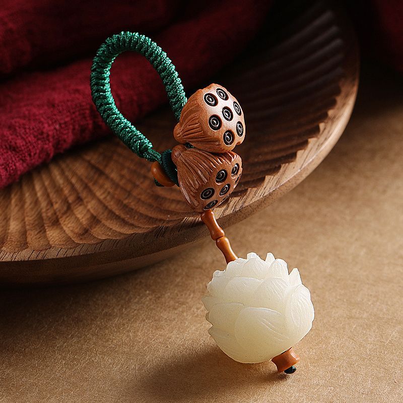 Porte-clés décoration porte-bonheur Foviel Lotus en graines de Bodhi blanc naturel et bois de pêcher