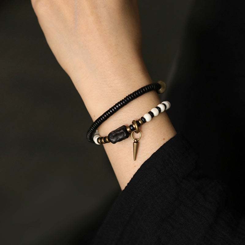 Bracelet de couple Foviel en perles d'os, bois d'ébène et cuivre, symbole de force