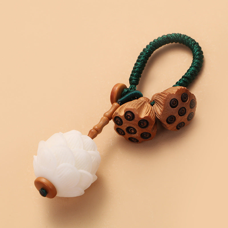 Porte-clés décoration porte-bonheur Foviel Lotus en graines de Bodhi blanc naturel et bois de pêcher