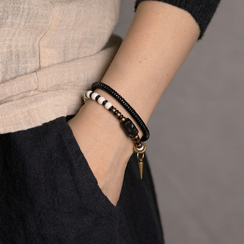Bracelet de couple Foviel en perles d'os, bois d'ébène et cuivre, symbole de force