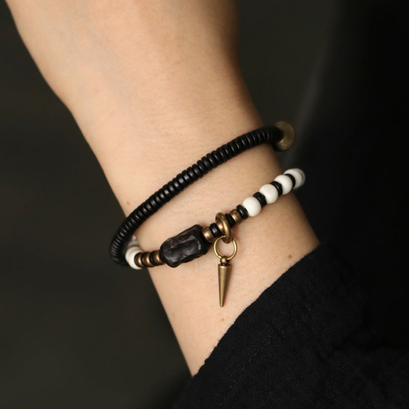 Bracelet de couple Foviel en perles d'os, bois d'ébène et cuivre, symbole de force