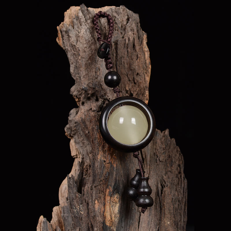 Porte-clés gourde porte-bonheur lumineux en bois de santal rouge, bois d'ébène et bois de santal vert Foviel