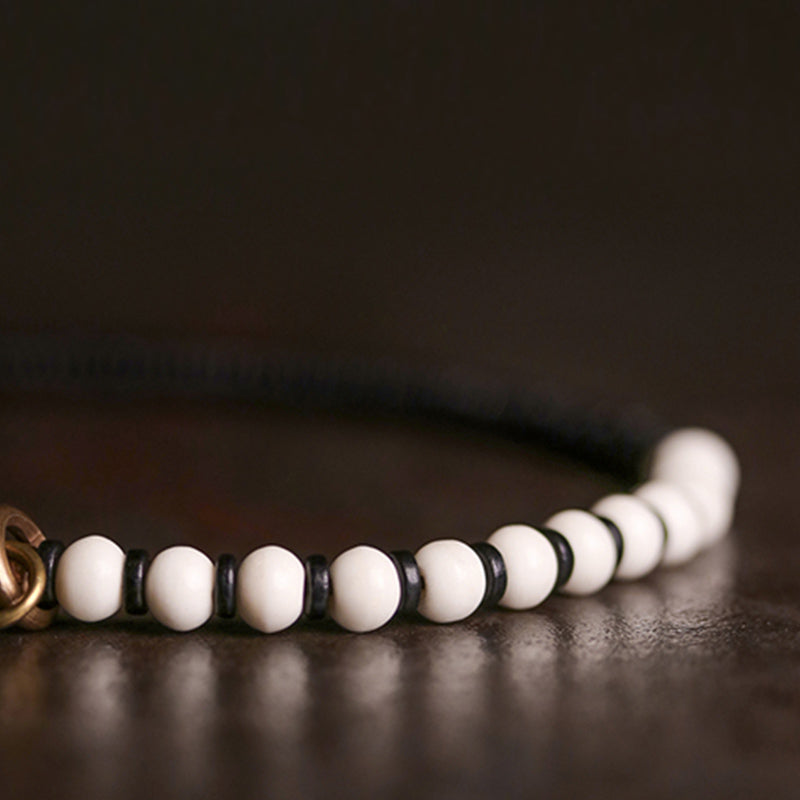 Bracelet de couple Foviel en perles d'os, bois d'ébène et cuivre, symbole de force
