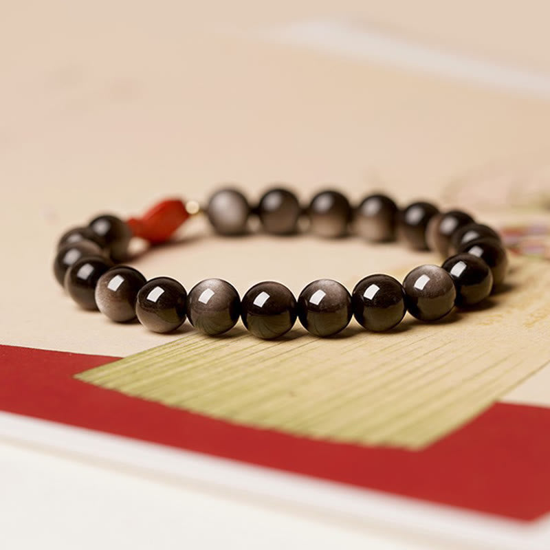 Bracelet Foviel en obsidienne argentée naturelle, cinabre et motif de poisson koï pour une protection apaisante