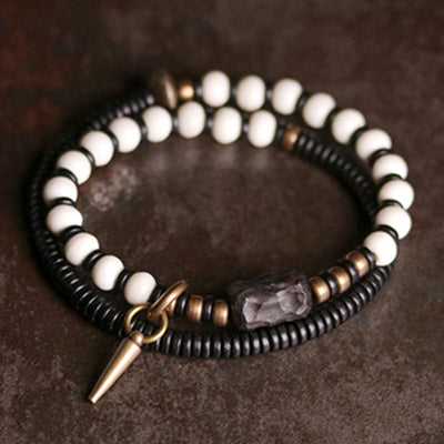 Bracelet de couple Foviel en perles d'os, bois d'ébène et cuivre, symbole de force