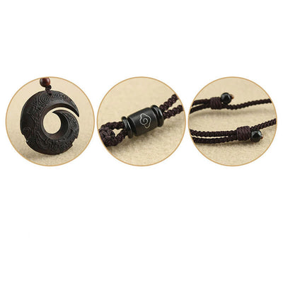Pendentif collier Foviel en bois d'ébène et bois de santal, motif design porte-bonheur et paix