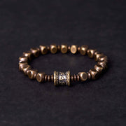 Bracelet de concentration Foviel tibétain avec amulette en cuivre et laiton gravée du mantra Om Mani Padme Hum