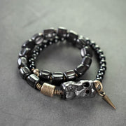 Bracelet double tour Foviel en bois d'ébène, obsidienne noire, cuivre et laiton, symbole de paix