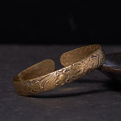 Bracelet jonc porte-bonheur en cuivre et laiton sculpté motif Dragon et Phénix jouant avec une perle Foviel