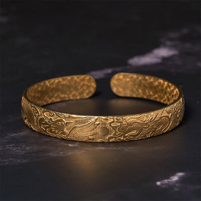 Bracelet jonc porte-bonheur en cuivre et laiton sculpté motif Dragon et Phénix jouant avec une perle Foviel