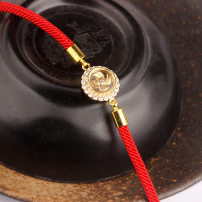 Bracelet tressé de protection Feng Shui à moulinet rotatif en fil rouge, cuivre et laiton Foviel