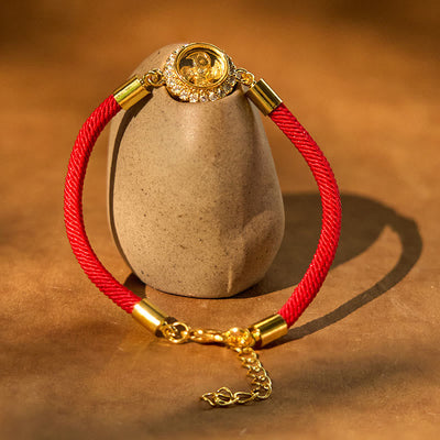 Bracelet tressé de protection Feng Shui à moulinet rotatif en fil rouge, cuivre et laiton Foviel
