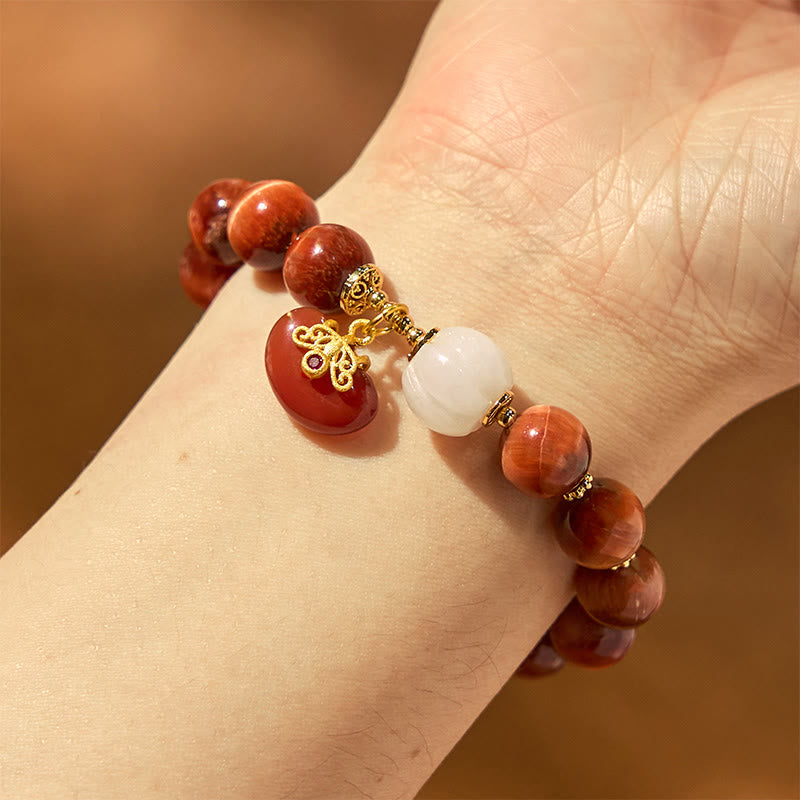 Bracelet apaisant Foviel en pierre œil-de-tigre rouge naturelle en forme de citrouille