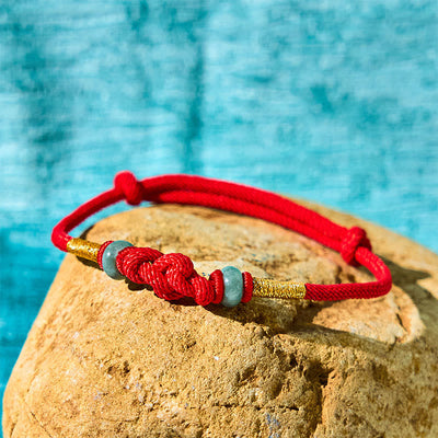 Bracelet couple tressé Foviel à nœud chinois en jade et fil rouge porte-bonheur
