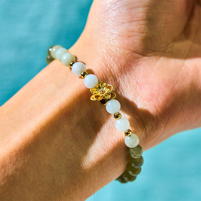 Bracelet Abondance Foviel en jade de Khotan naturel dégradé motif lotus