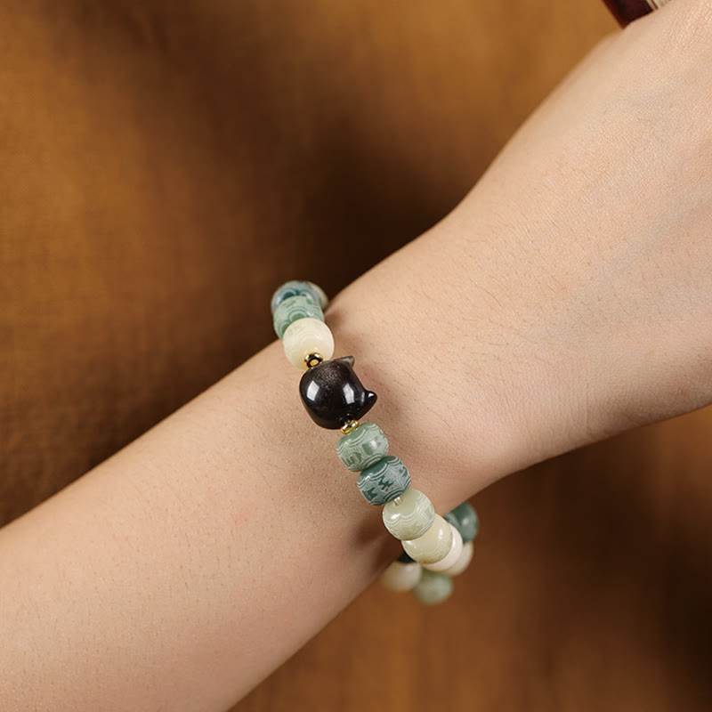 Bracelet de sagesse Foviel en obsidienne argentée sculptée en forme de tête de chat avec graine de Bodhi et mantra Om Mani Padme Hum