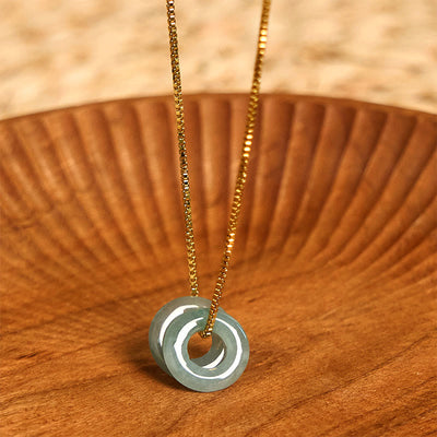 Pendentif de collier prospérité double boucle de paix en jade Foviel