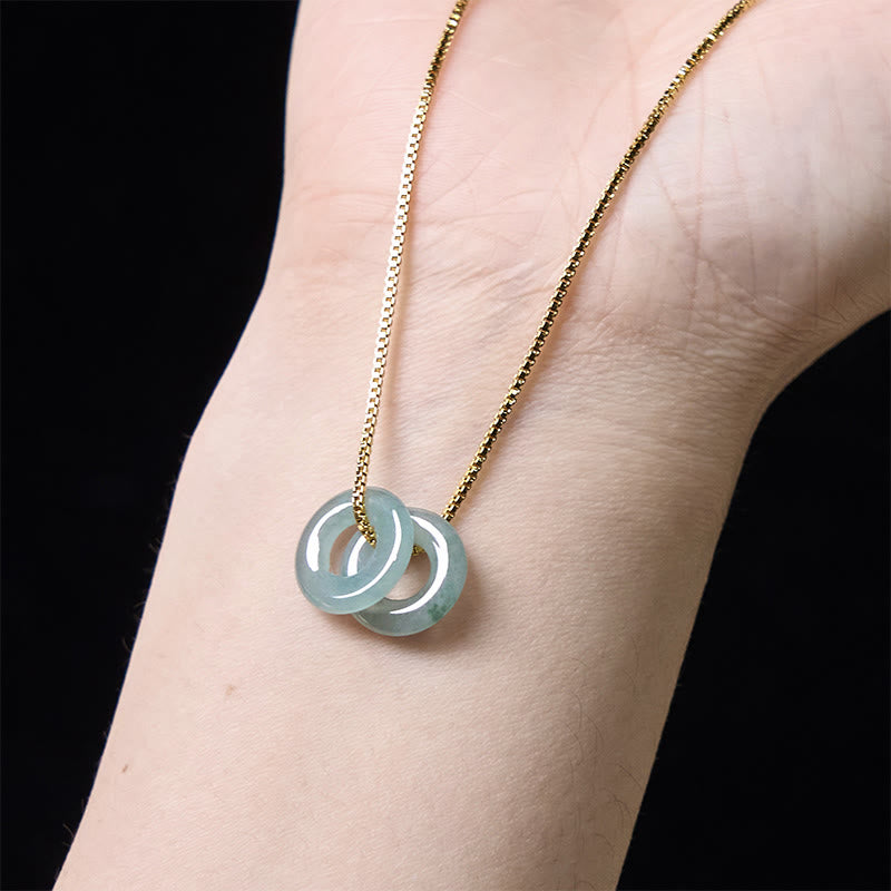 Pendentif de collier prospérité double boucle de paix en jade Foviel