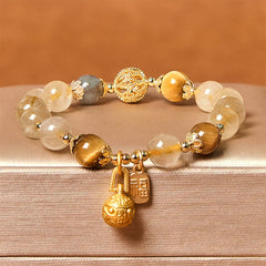 Bracelet Foviel en quartz rutile naturel avec caractère Fu et motif de bête avaleuse de métal porte-bonheur
