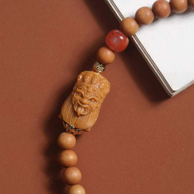 Bracelet de fortune Foviel en agate rouge du Sud et bois de santal, à l'effigie de Zakiram, la déesse tibétaine de la richesse