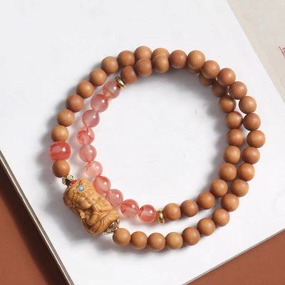 Bracelet de fortune Foviel en agate rouge du Sud et bois de santal, à l'effigie de Zakiram, la déesse tibétaine de la richesse