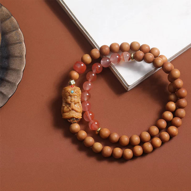 Bracelet de fortune Foviel en agate rouge du Sud et bois de santal, à l'effigie de Zakiram, la déesse tibétaine de la richesse