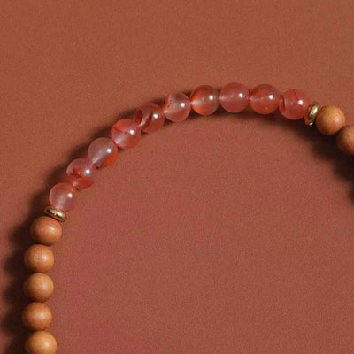 Bracelet de fortune Foviel en agate rouge du Sud et bois de santal, à l'effigie de Zakiram, la déesse tibétaine de la richesse