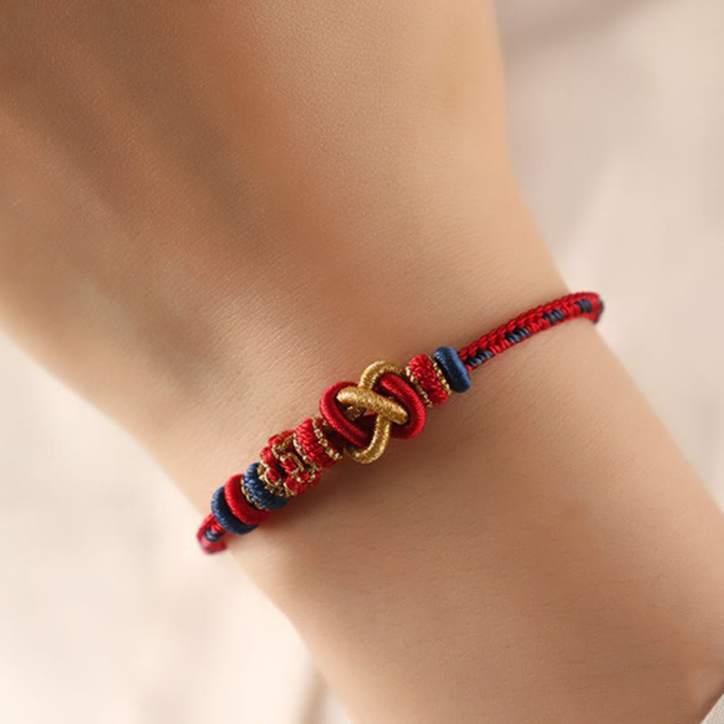 Bracelet réglable Foviel fait main en corde colorée avec nœud de paix et fleur de pêcher