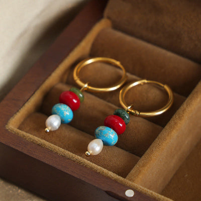 Boucles d'oreilles Foviel en acier titane avec perles en agate rouge naturelle et design de pierre Marnyi tibétaine, symbole de confiance