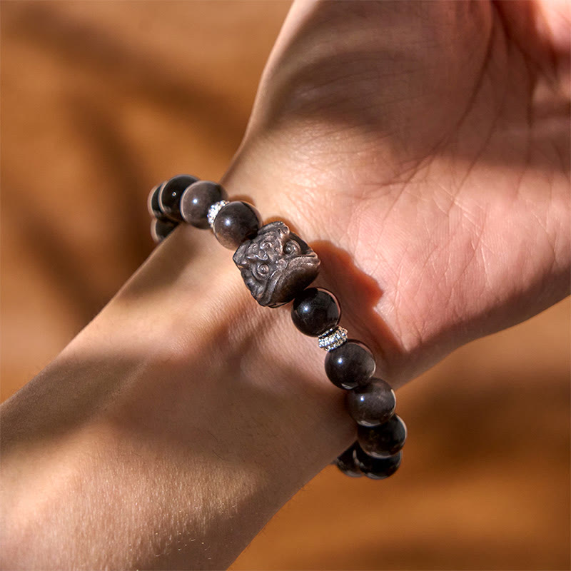 Foviel Natural Silver Sheen Obsidian Lion Dance Protection Bracelet