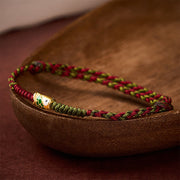 Bracelet ou chevillère tressé(e) Foviel, cordon coloré rouge et vert, motif poisson koï, porte-bonheur
