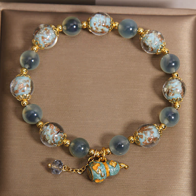 FREE Today: Strength and Harmony Blue Candy Agate Liuli Glass Gourd Charm Bracelet - image 1