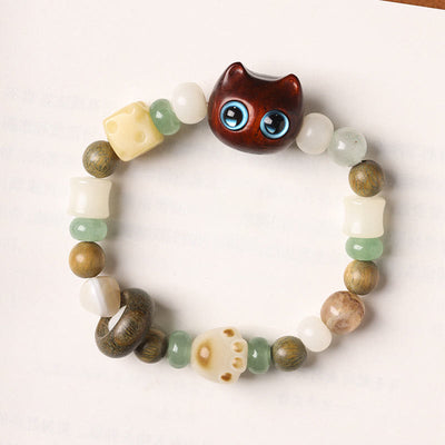 Bracelet de paix Foviel avec tête et patte de chat en graine de Bodhi, bois de santal vert, bois d'ébène et bois de santal rouge à petites feuilles