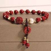 Bracelet porte-bonheur Foviel avec perle de cinabre naturel en forme de boucle de paix et pièce en cuivre