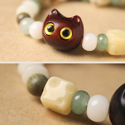 Bracelet de paix Foviel avec tête et patte de chat en graine de Bodhi, bois de santal vert, bois d'ébène et bois de santal rouge à petites feuilles