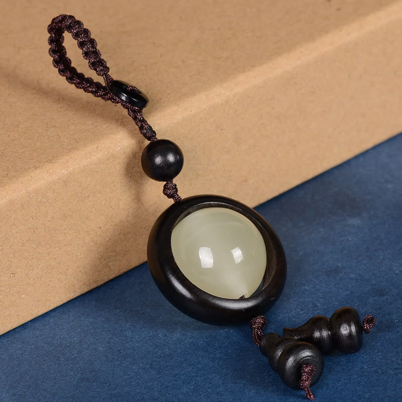 Porte-clés gourde porte-bonheur lumineux en bois de santal rouge, bois d'ébène et bois de santal vert Foviel