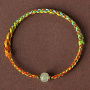 Bracelet de chance Foviel en corde colorée avec perle de jade, symbole d'abondance