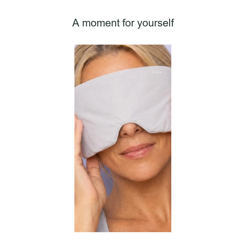Front view of a woman wearing the gray wrap eye mask