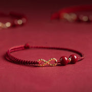 Bracelet ou chevillère Foviel avec cordon rouge bénédiction cinabre et symbole infini doré