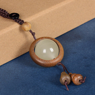 Porte-clés gourde porte-bonheur lumineux en bois de santal rouge, bois d'ébène et bois de santal vert Foviel