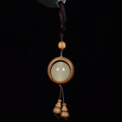 Porte-clés gourde porte-bonheur lumineux en bois de santal rouge, bois d'ébène et bois de santal vert Foviel