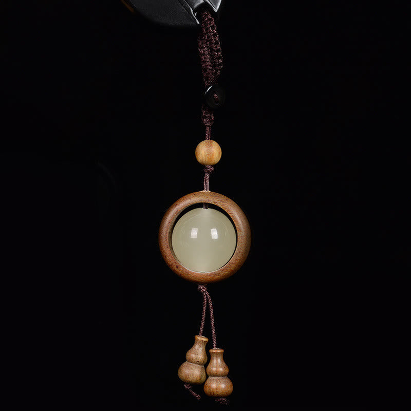 Porte-clés gourde porte-bonheur lumineux en bois de santal rouge, bois d'ébène et bois de santal vert Foviel
